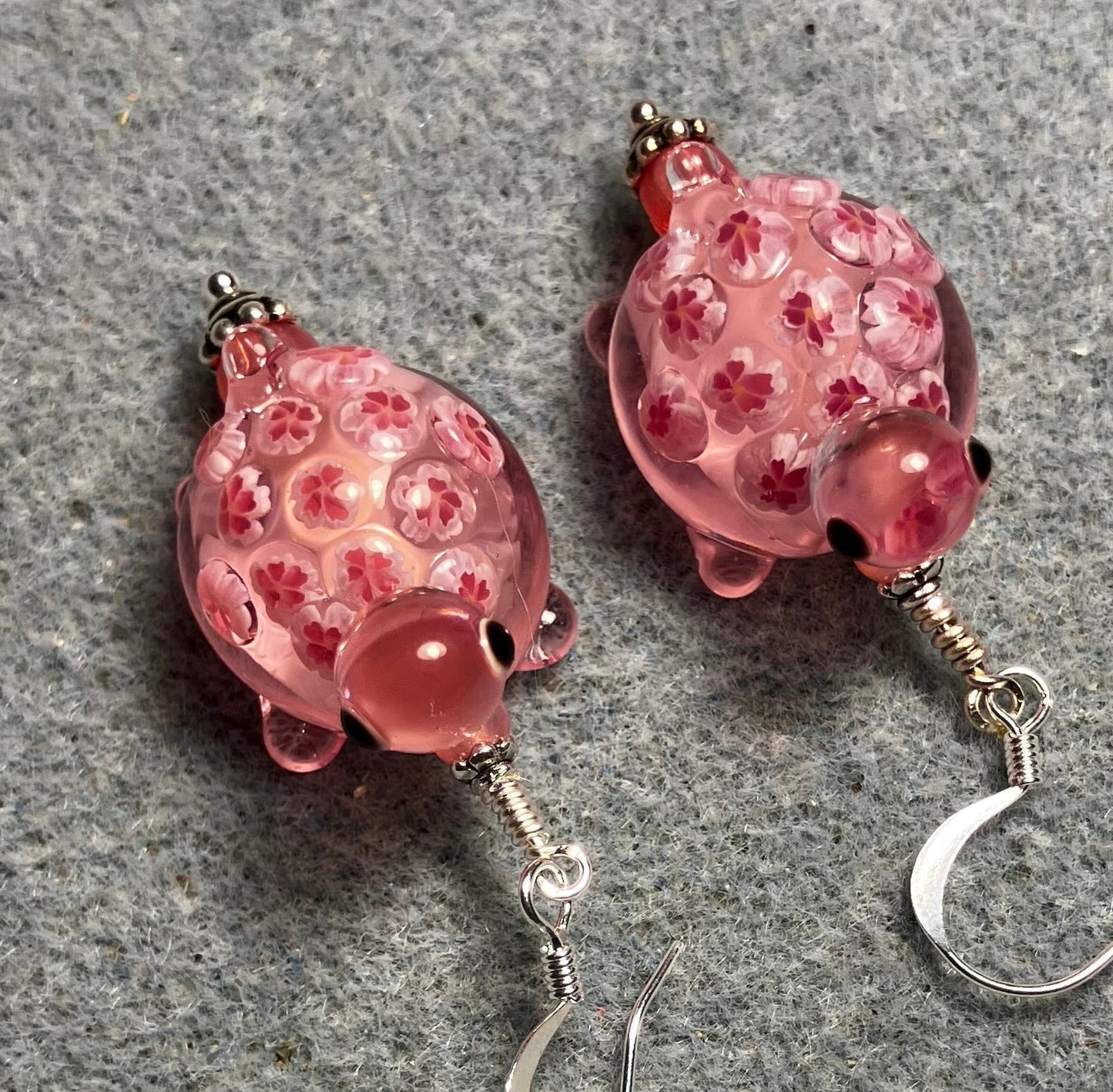 Large pink lamp work turtle bead earrings adorned with pink Czech glass beads.