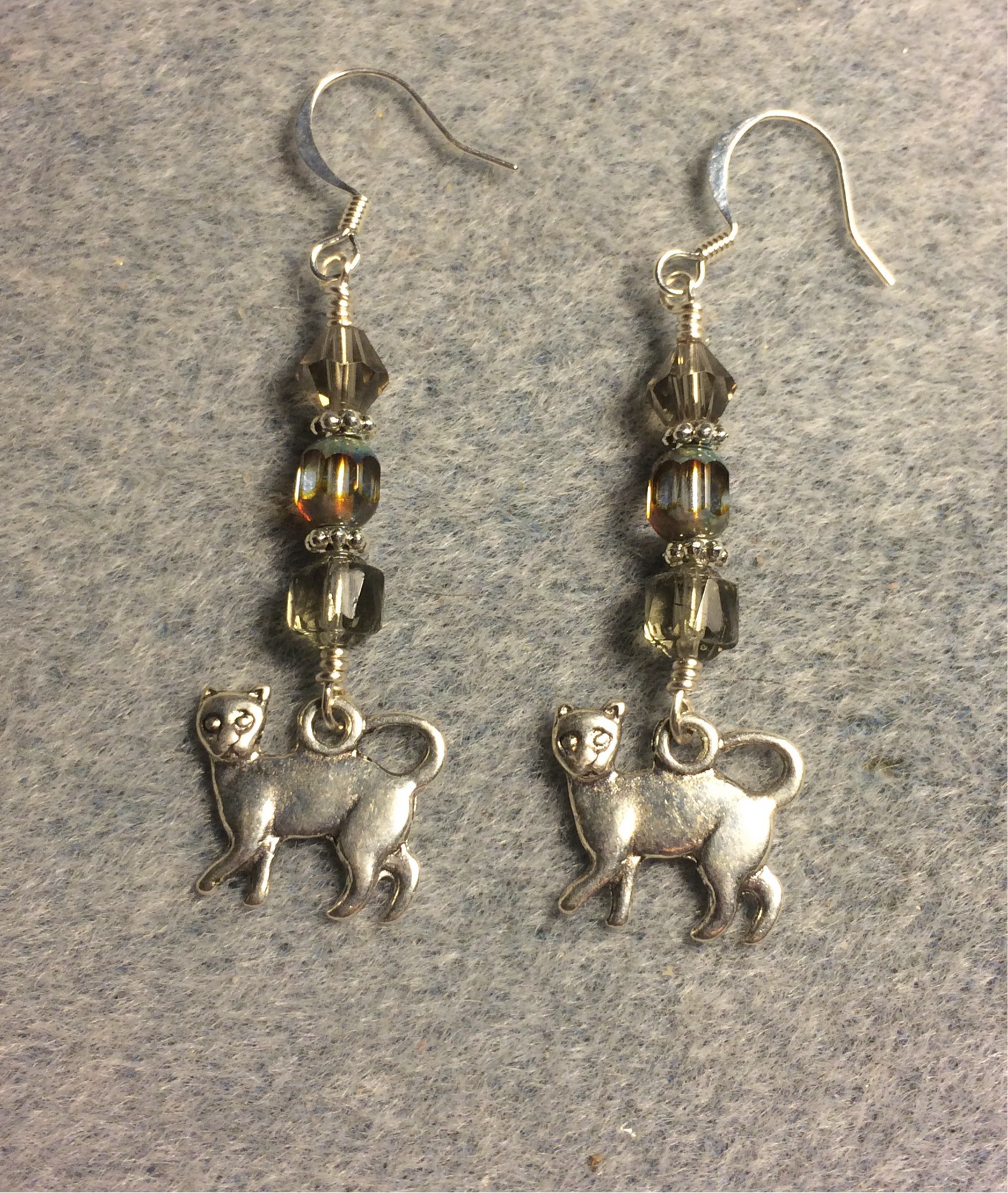 Silver cat charm earrings adorned with gray Czech glass beads