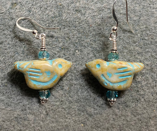 Beige yellow (with turquoise wash) Czech glass bird bead earrings adorned with turquoise Chinese crystal beads.
