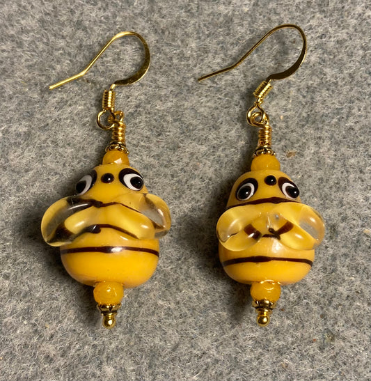 Golden yellow and black lamp work striped honeybee bead earrings adorned with golden yellow Chinese crystal beads.