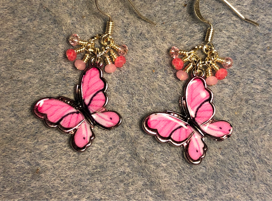 Hot pink enamel butterfly charm earrings adorned with tiny dangling hot pink and light pink Chinese crystal beads.