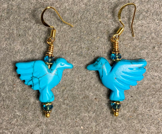 Turquoise howlite gemstone flying eagle bead earrings adorned with turquoise Chinese crystal beads.