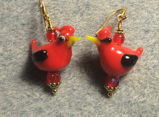 Opaque red lamp work cardinal bead earrings adorned with red Czech glass beads.