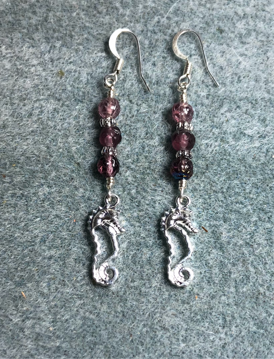 Small silver seahorse charm earrings adorned with small purple Czech glass beads.
