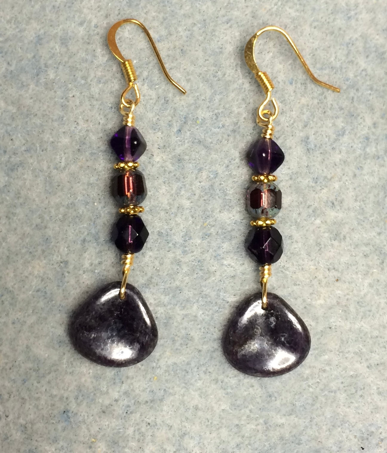 Dark purple Czech glass rose petal earrings adorned with dark purple Czech glass beads.