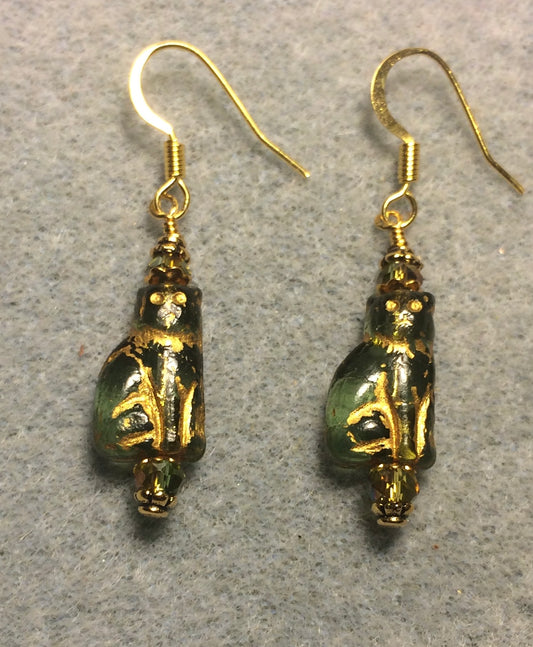 Small translucent bluish green and gold Czech glass cat bead earrings adorned with green Chinese crystal beads.