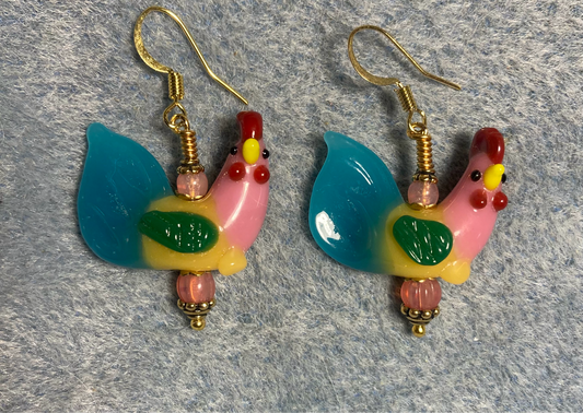 Pink, turquoise, green, and red lamp work rooster bead earrings adorned with pink Czech glass beads.