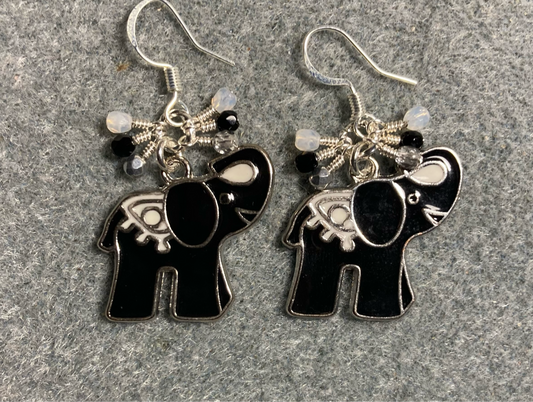 Black and white enamel elephant charm earrings adorned with tiny dangling black, white, and silver Czech glass beads.