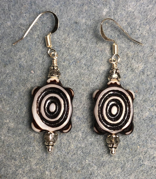 Grey and black Czech glass turtle bead earrings adorned with grey Chinese crystal beads.