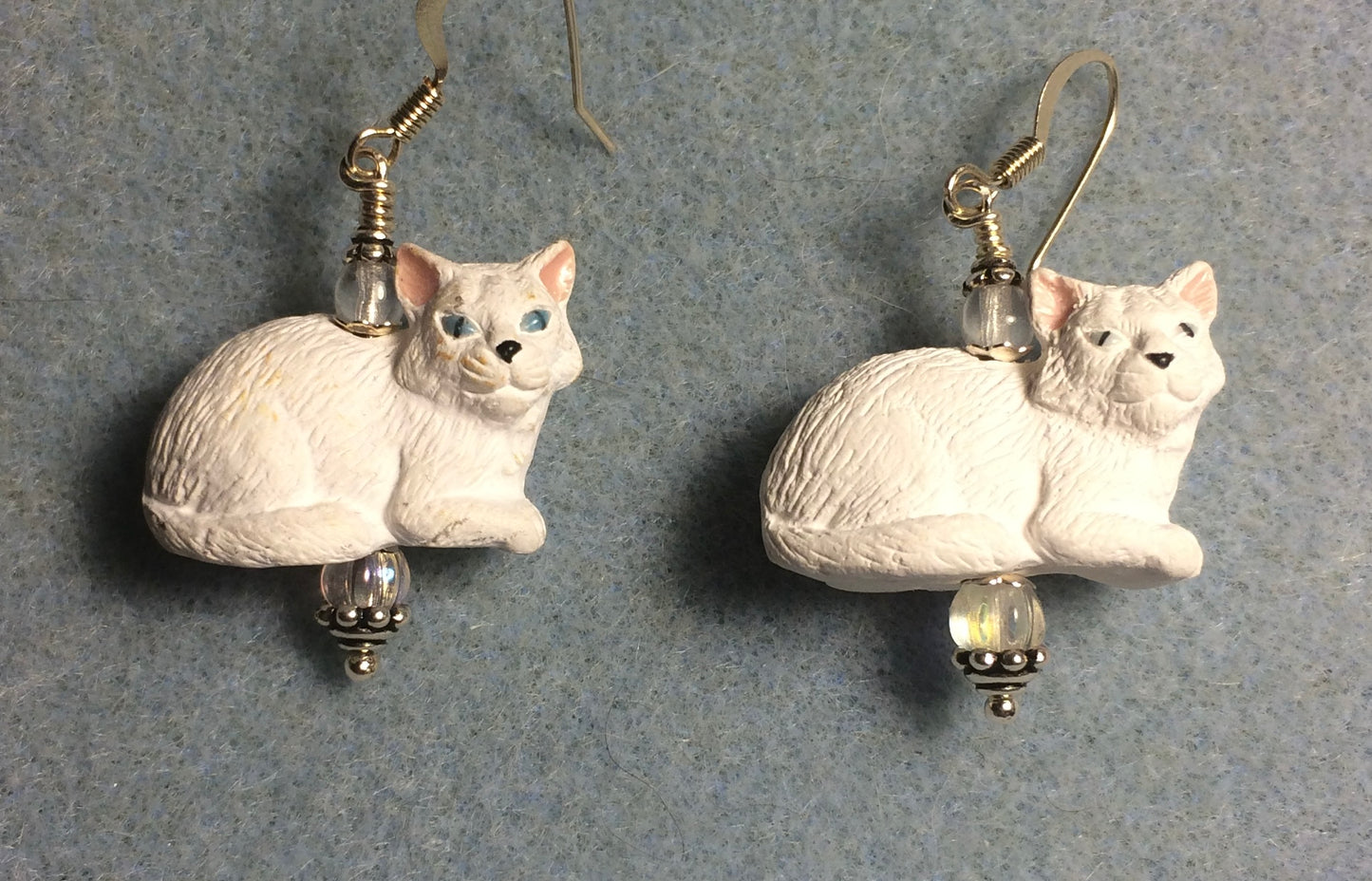 White ceramic cat bead earrings adorned with clear Czech glass beads.