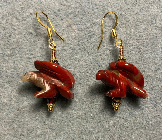 Large red poppy jasper gemstone flying eagle bead earrings adorned with dark red Chinese crystal beads.