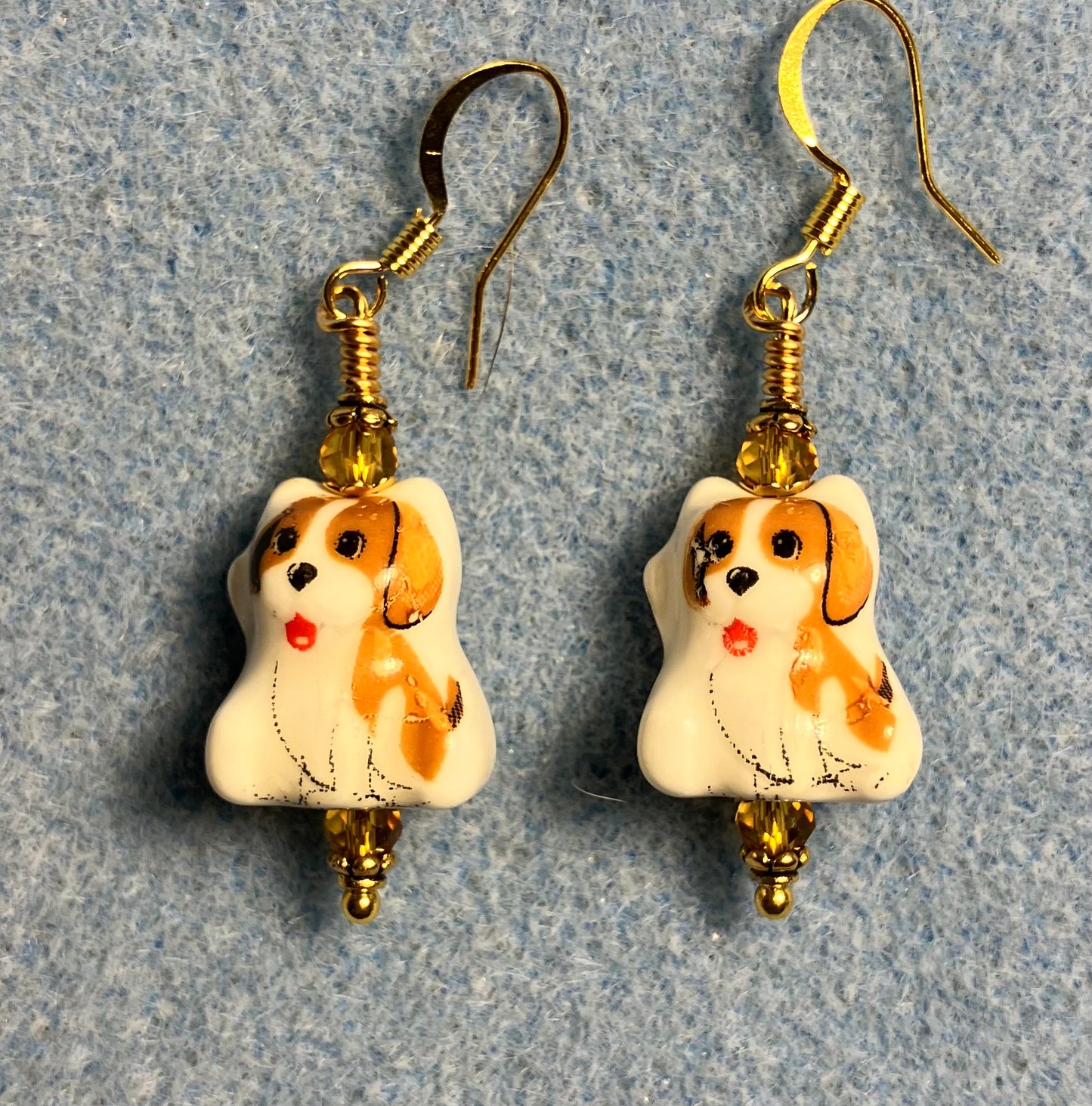 Amber and white ceramic puppy dog bead earrings adorned with amber Chinese crystal beads.