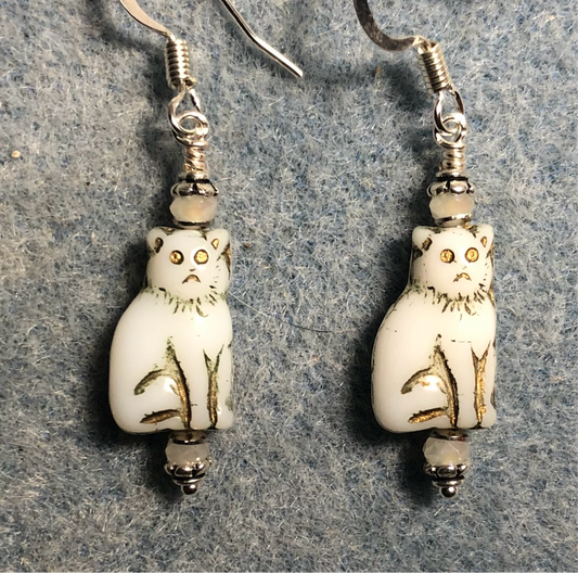 Small white (with gold inlay) Czech glass cat bead earrings adorned with white Chinese crystal beads.