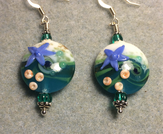 Teal, white, and blue lamp work starfish bead earrings adorned with teal Czech glass beads.