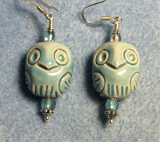 Light blue ceramic owl bead earrings adorned with light blue Czech glass beads.