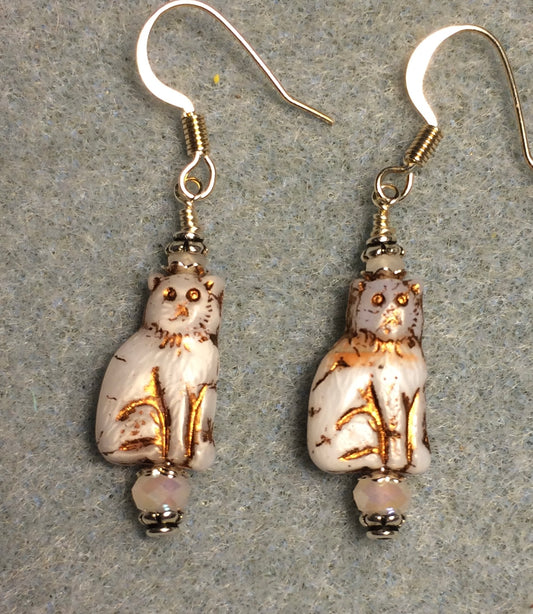 Small opaque white (with copper inlay) Czech glass cat bead earrings adorned with white Chinese crystal beads.