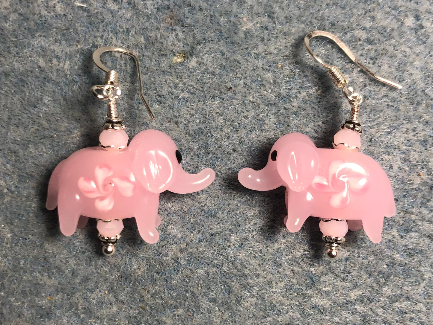 Opaque pink lamp work elephant bead earrings adorned with pink Chinese crystal beads.