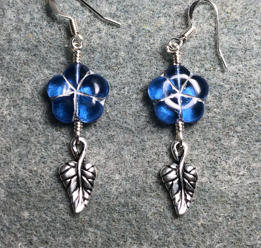 Light blue (with silver inlay) Czech glass puffy flower bead earrings adorned with silver Tierracast leaf charms.