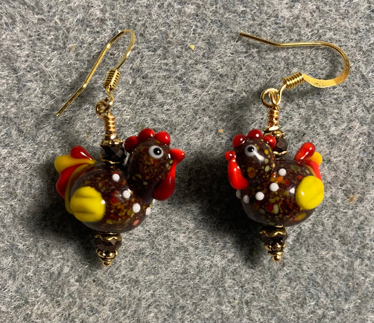 Small brown and yellow lamp work chicken bead earrings adorned with brown Chinese crystal beads.