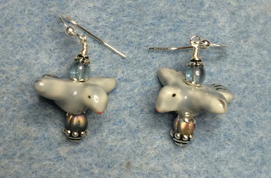 Blue gray ceramic flying bird bead earrings adorned with blue gray Czech glass beads.