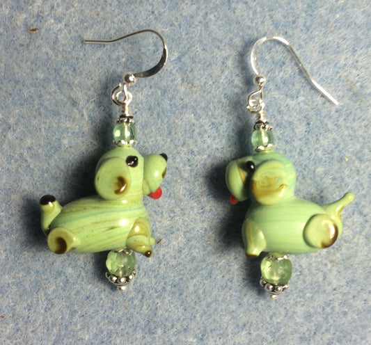 Green lamp work puppy dog bead earrings adorned with green Czech glass beads.