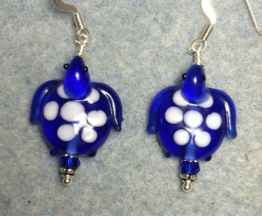 Dark blue and white lamp work spotted turtle bead earrings adorned with dark blue Chinese crystal beads.