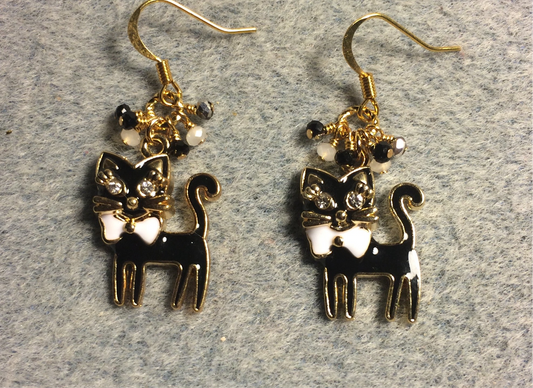 Black and white enamel and rhinestone cat charm earrings adorned with small dangling black and white Chinese crystal beads.