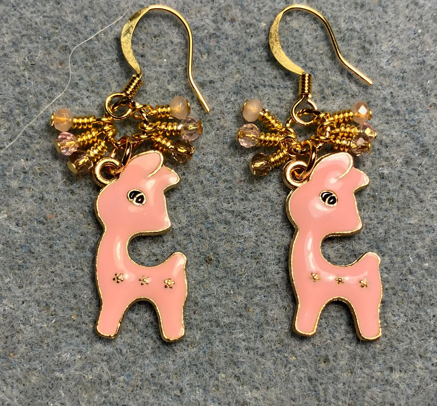 Peach pink enamel deer charm earrings adorned with tiny dangling pink and peach Chinese crystal beads.