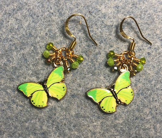 Apple green enamel butterfly charm earrings adorned with tiny dangling apple green and olive green Chinese crystal beads.