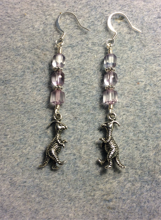 Silver dinosaur charm earrings adorned with light violet Czech glass beads