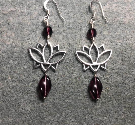 Silver lotus flower connector charm earrings adorned with violet Czech glass twist beads and violet Czech glass beads.