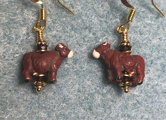 Small dark red ceramic cow bead earrings adorned with dark red Chinese crystal beads.