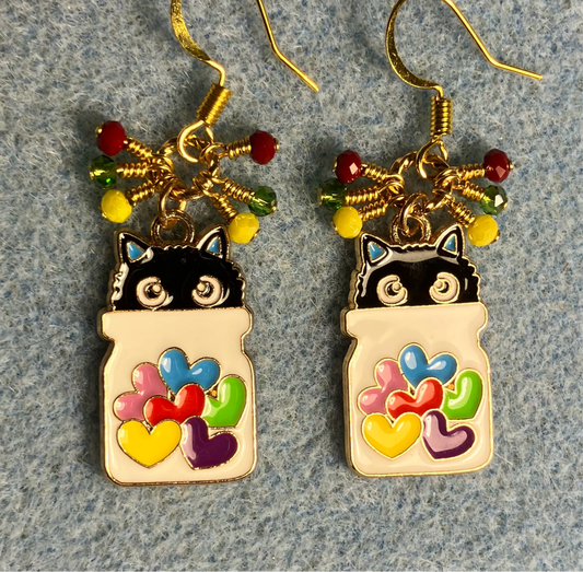 White, black, red, yellow, and green enamel cat charm earrings adorned with tiny dangling red, yellow, and green Chinese crystal beads.