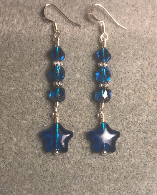 Small bright blue turquoise Czech glass star bead earrings adorned with bright blue turquoise Czech glass beads.