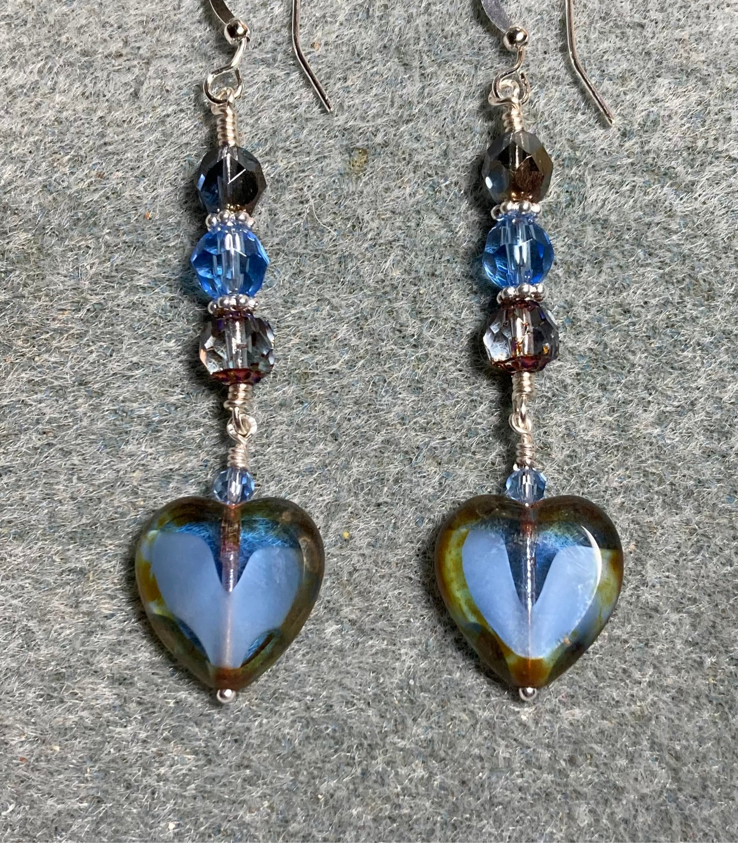 Montana blue Czech glass heart bead earrings adorned with Montana blue Czech glass beads.