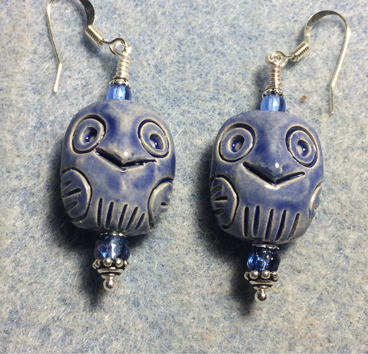Dark blue ceramic owl bead earrings adorned with dark blue Czech glass beads.