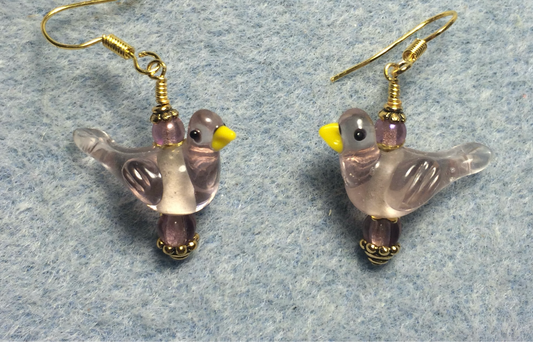 Translucent violet lamp work songbird bead earrings adorned with violet Czech glass beads.