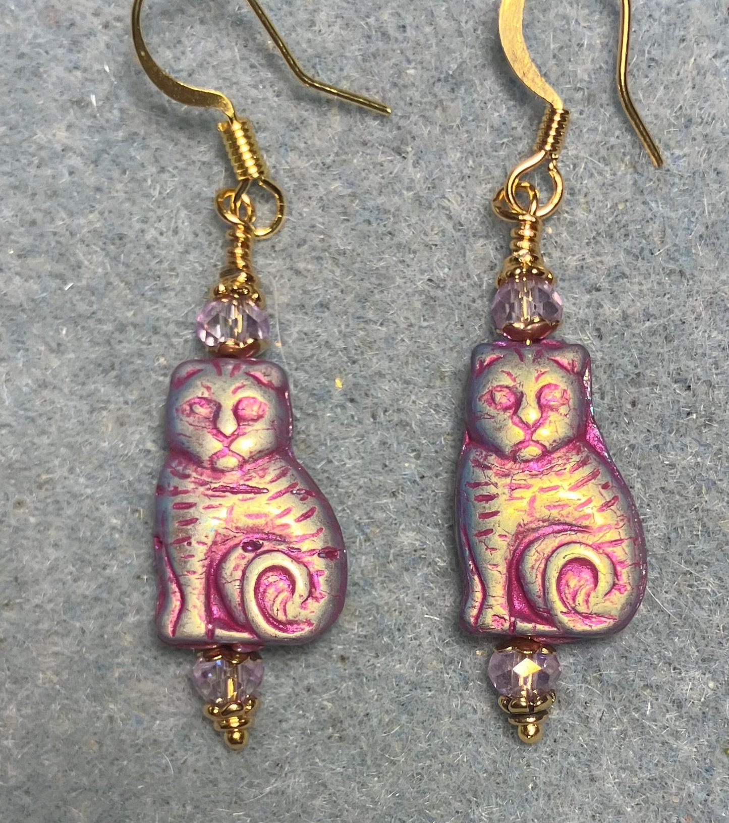 Medium metallic violet Czech glass cat bead earrings adorned with violet Chinese crystal beads.