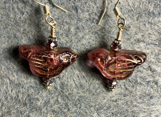 Purple (with silver wash) Czech glass bird bead earrings adorned with purple Chinese crystal beads.