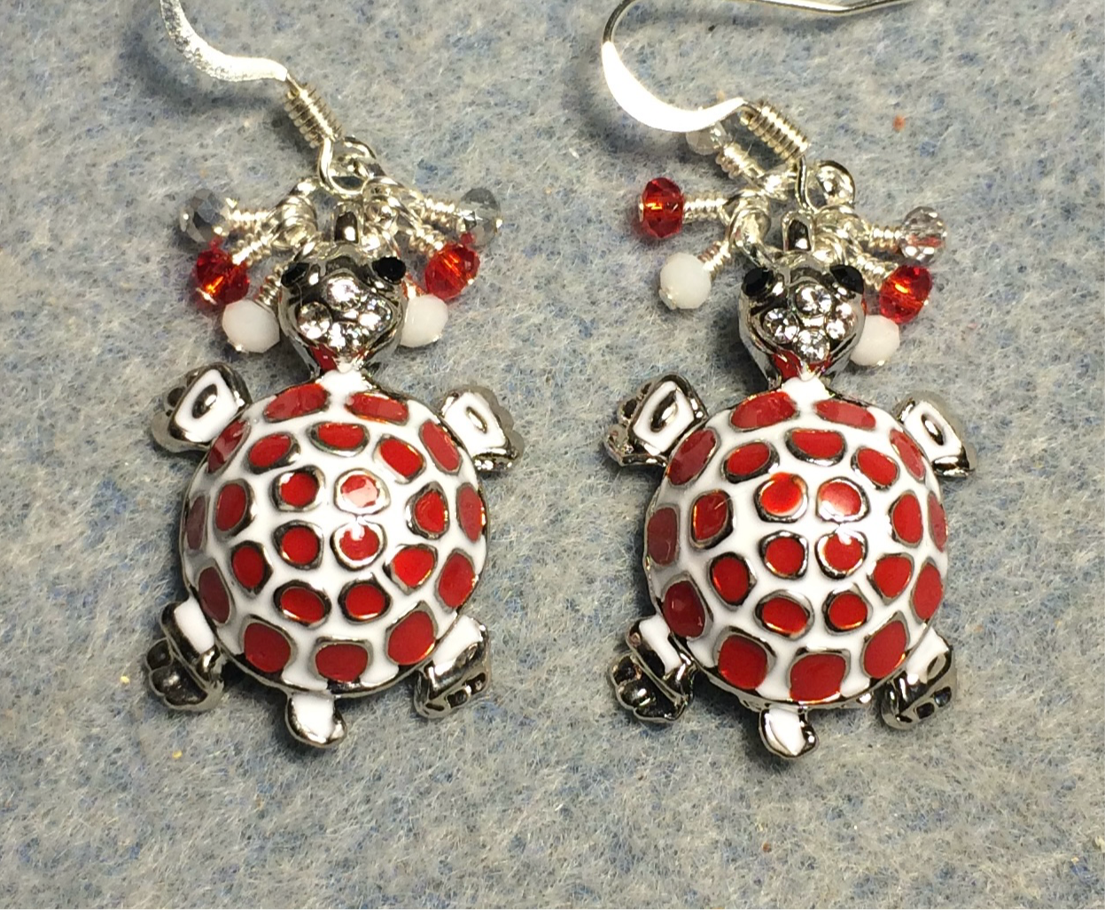 Red and white enamel mosaic turtle charm earrings adorned with tiny dangling red and white Chinese crystal beads.