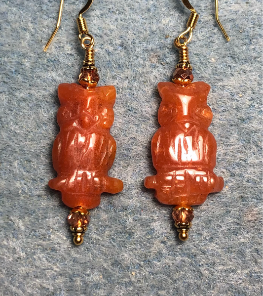 Orange aventurine gemstone owl bead earrings adorned with orange gold Chinese crystal beads.