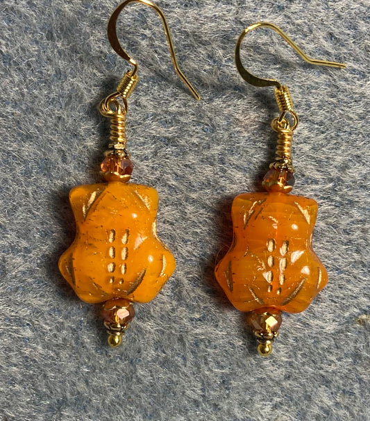 Tangerine (with gold inlay) Czech glass frog bead earrings adorned with tangerine Chinese crystal beads.