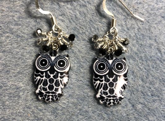 Black, white, and silver enamel owl charm earrings adorned with tiny dangling black and silver Chinese crystal beads.
