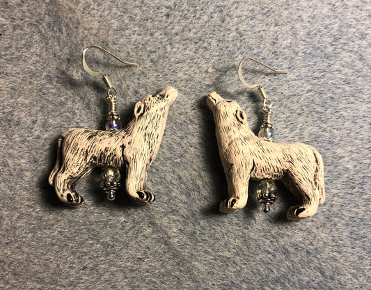 Off white ceramic howling wolf bead earrings adorned with gray Czech glass beads.