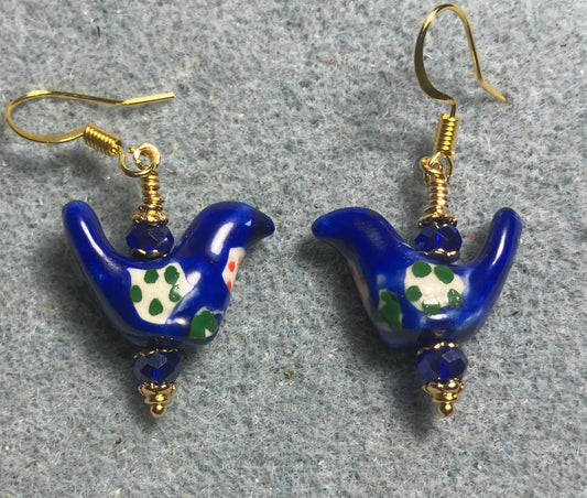 Small dark blue, white, and green ceramic bird bead earrings adorned with dark blue Chinese crystal beads.