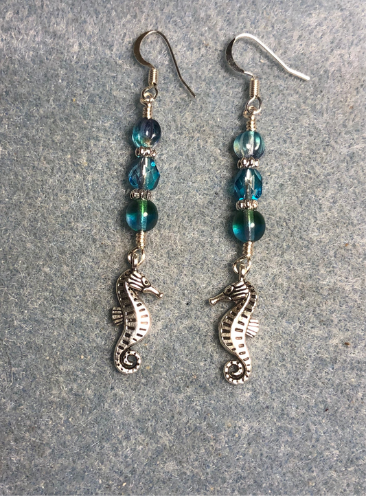Silver seahorse charm earrings adorned with turquoise purple Czech glass beads