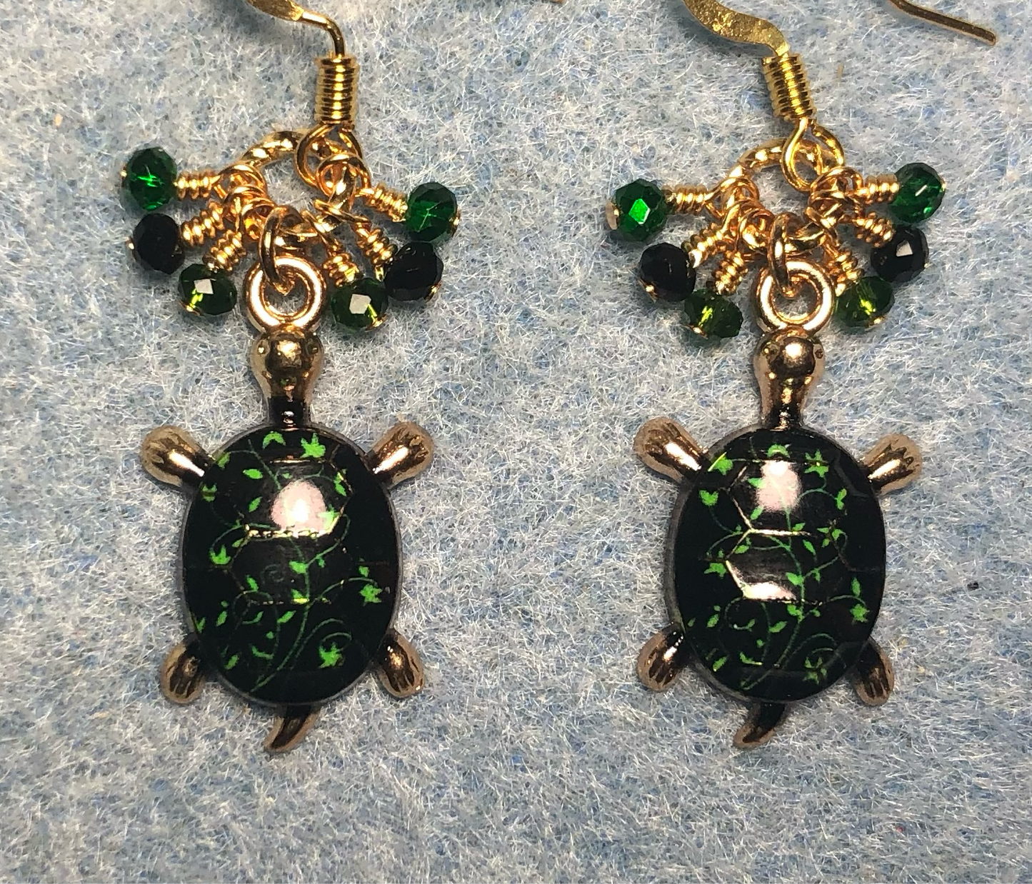 Dark green and black enamel turtle charm earrings adorned with tiny dangling dark green and black Chinese crystal beads.