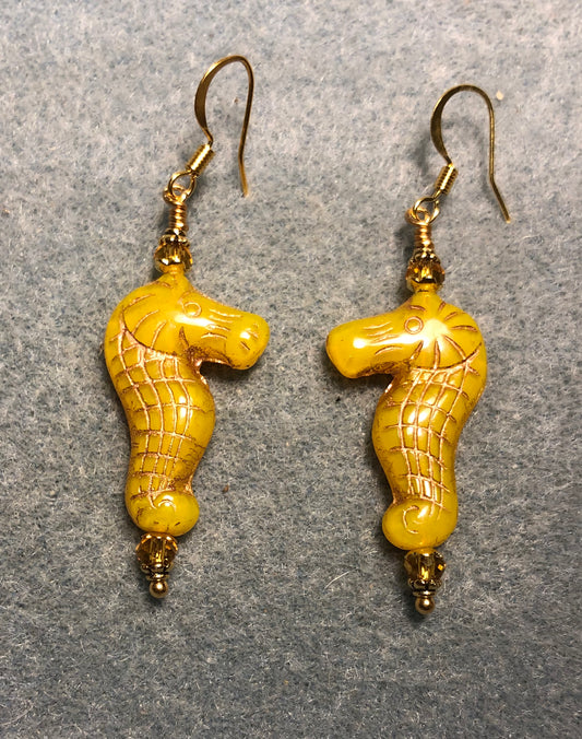 Yellow amber (with gold inlay) Czech glass seahorse bead earrings adorned with amber Chinese crystal beads.