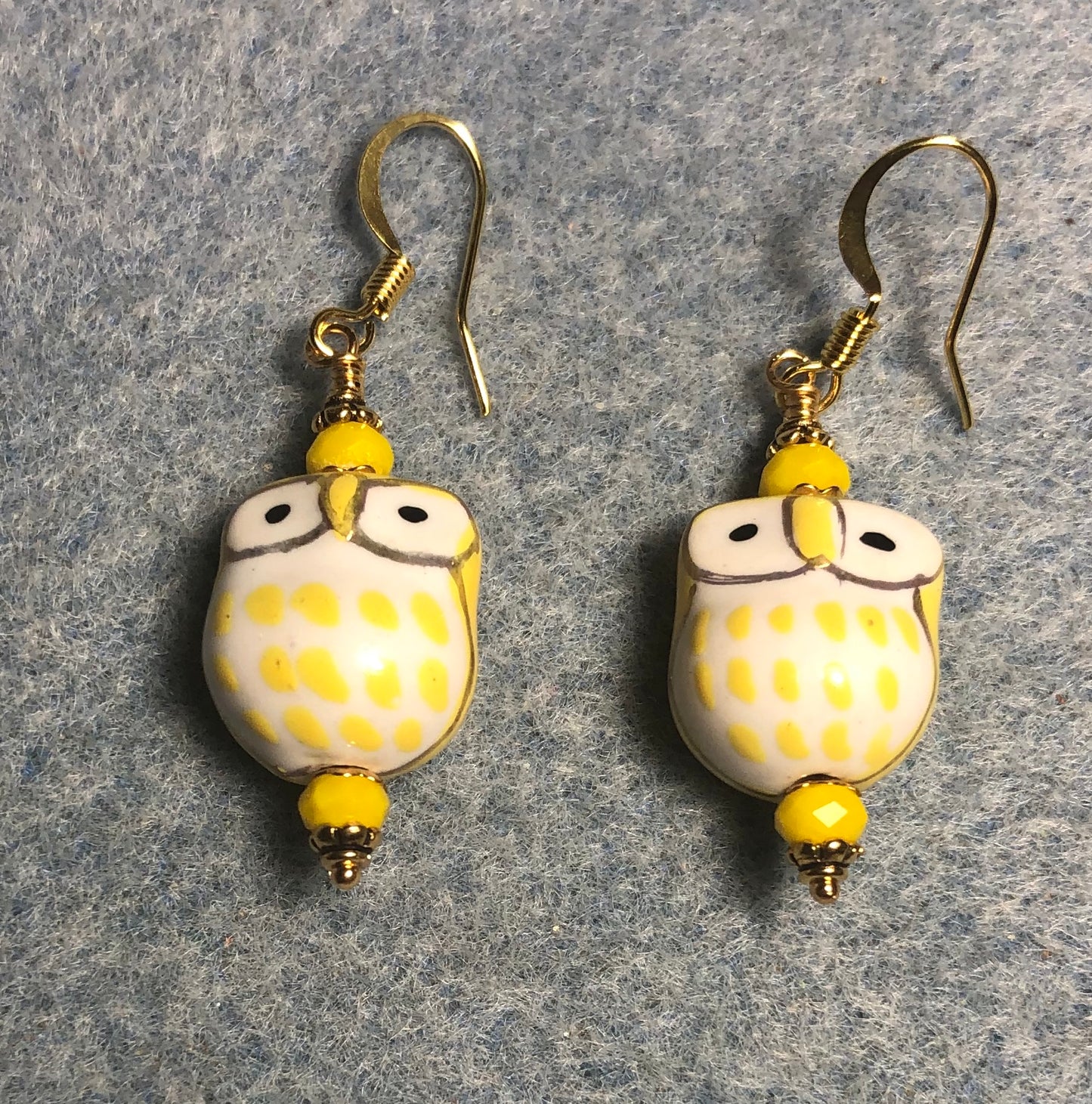 Yellow ceramic spotted owl bead earrings adorned with opaque yellow Chinese crystal beads.