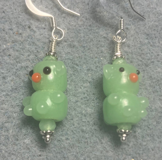 Small light green lamp work teddy bear bead earrings adorned with light green Chinese crystal beads.